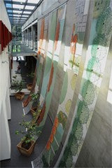 interior of library building, using picture hanging system to display large banners