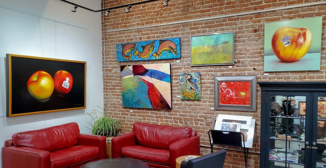 art gallery sitting area with display of paintings hung using a picture hanging system