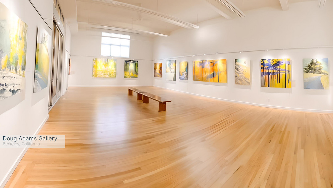 Art gallery with wooden floor and wall displays of colorful artworks