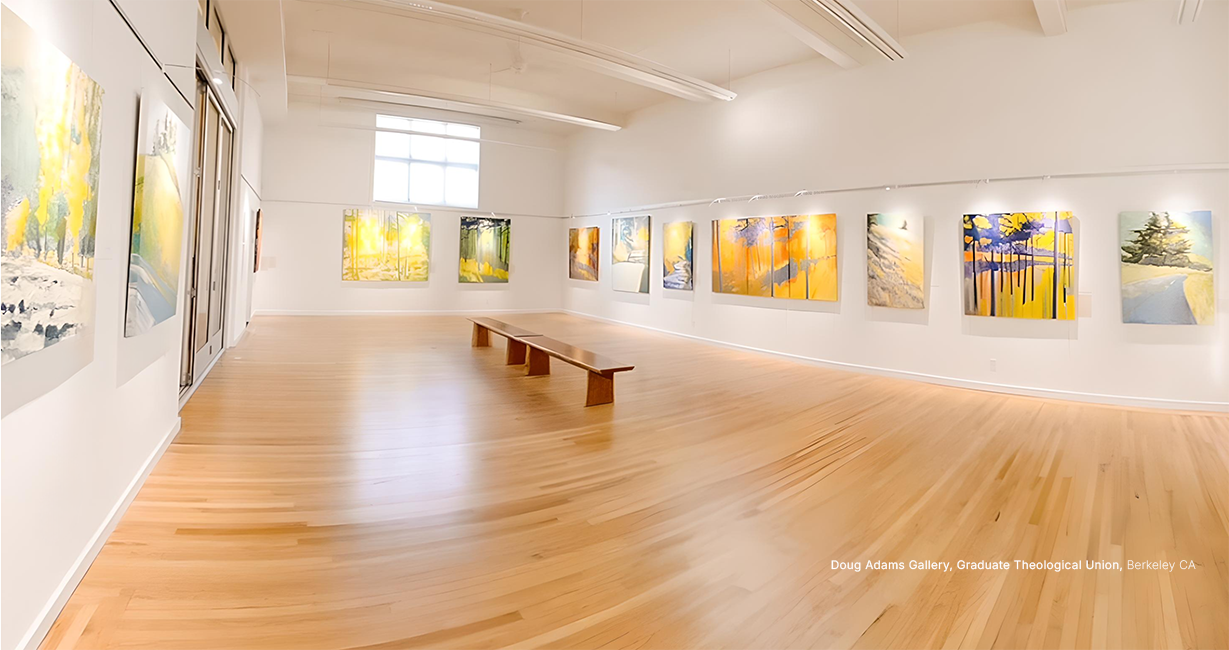 Art gallery with wooden floor and wall displays of colorful artworks