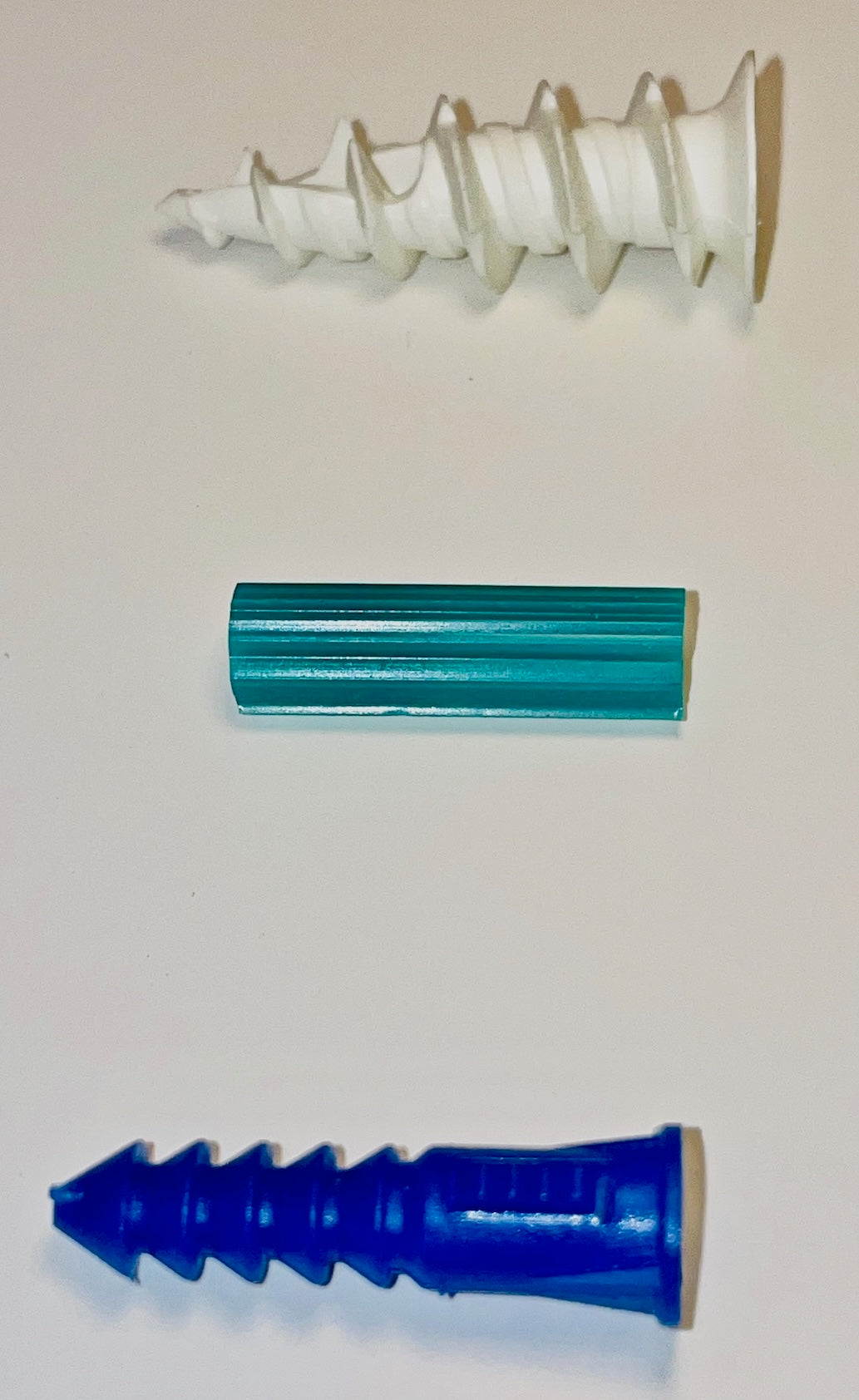 three light duty plastic drywall anchors for screws