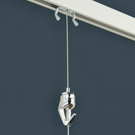 Wall mounted art hanging system  showing wall track, steel cable hanger, and pushbutton adjustable hook