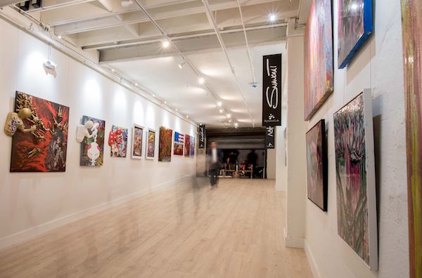 Interior of art gallery with art hanging system installed