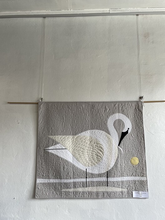 Handmade quilt with image of swan displayed using the Gallery System picture hangiung 