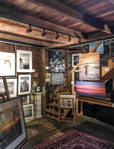 Interior of rustic art gallery with picture hanging system